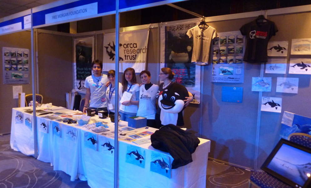 WhaleFest 2014, FMF booth with volunteers - note the children's pictures along the font of the tables & on the walls.